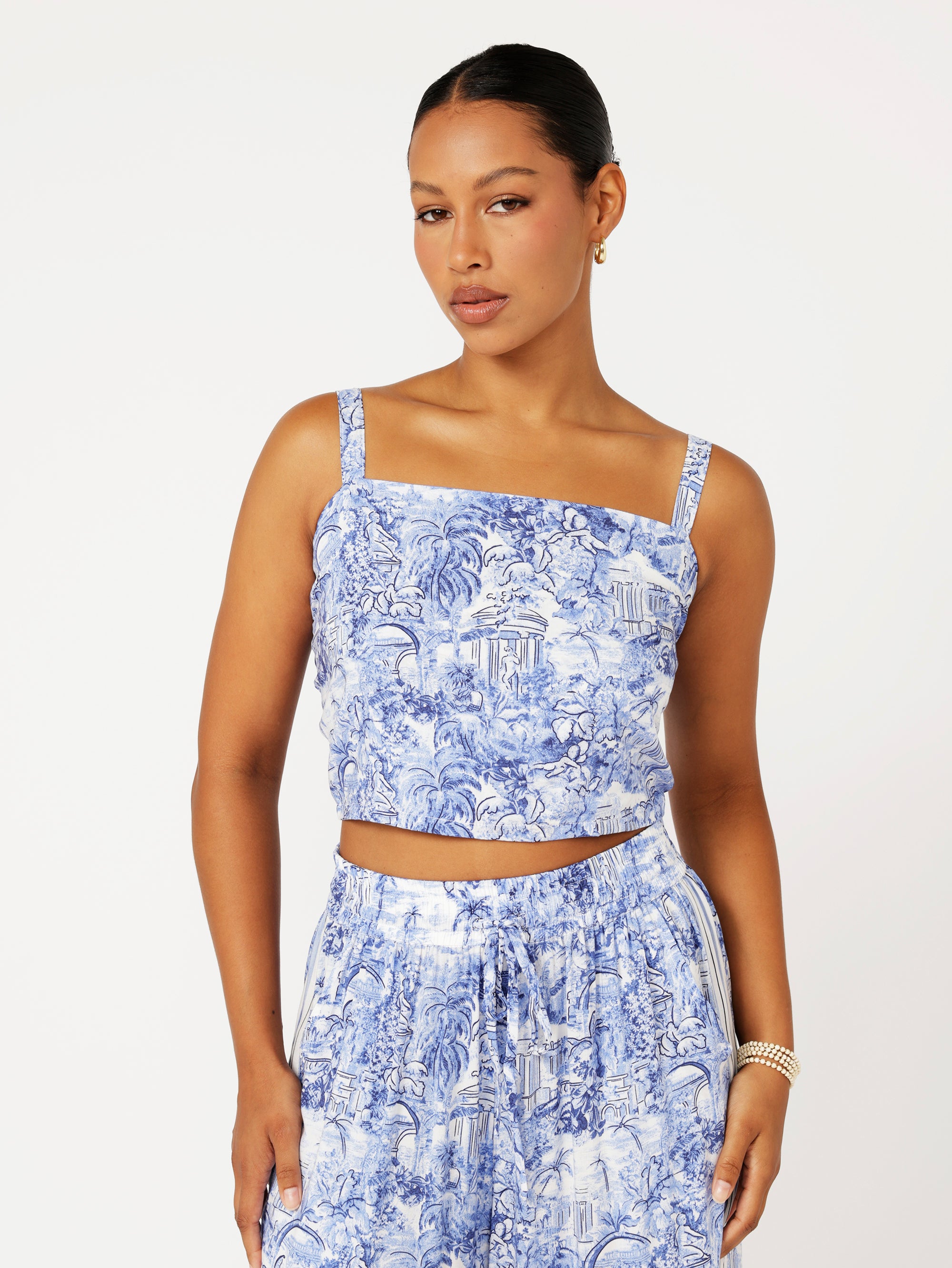 Front view of model wearing the Lost City Bralette in blue Toile de Jouy rayon print