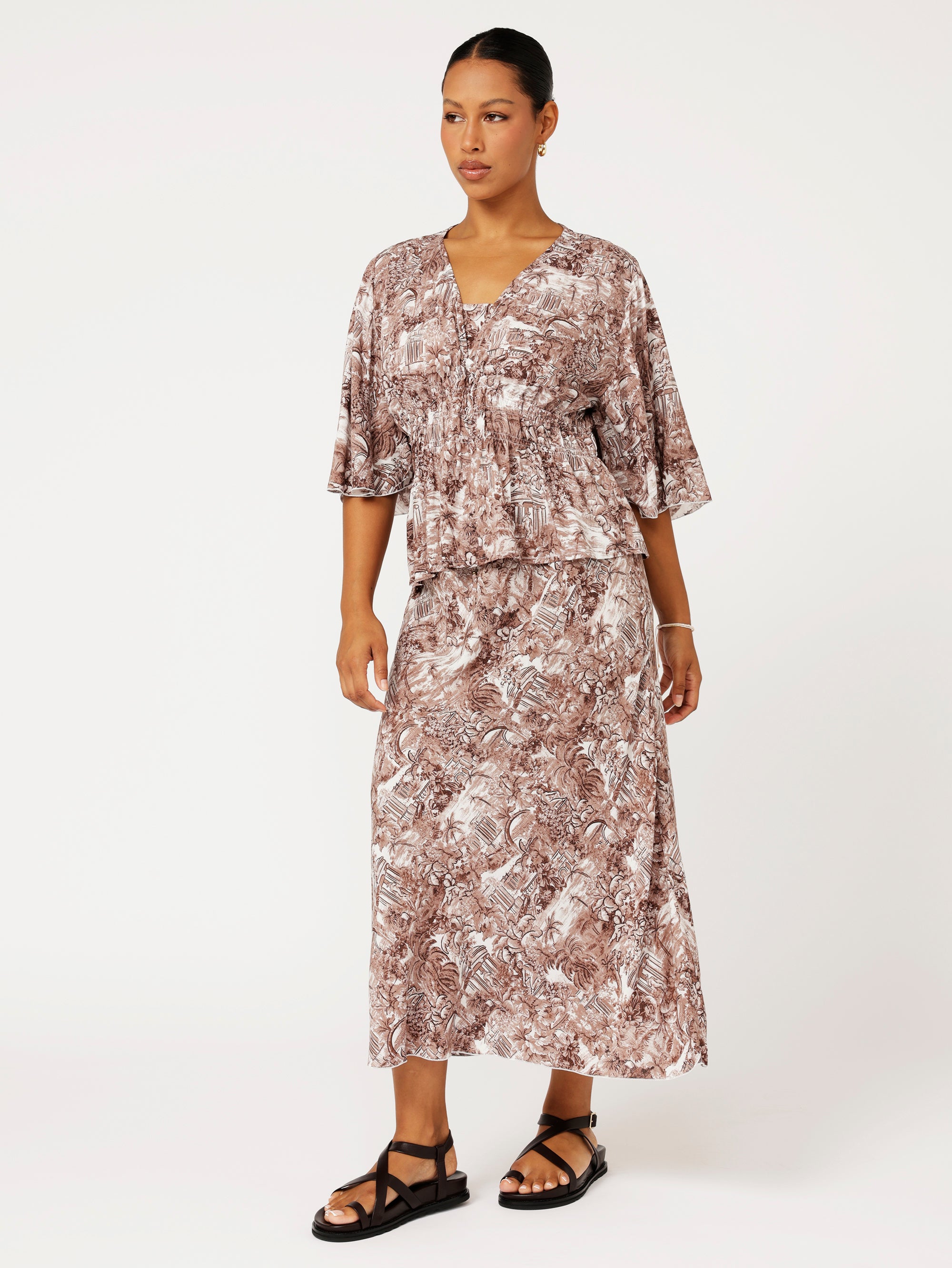 Front view of model wearing the Violet Skirt in chocolate Toile de Jouy rayon print, styled with matching Thalia Top for a coordinated resort look