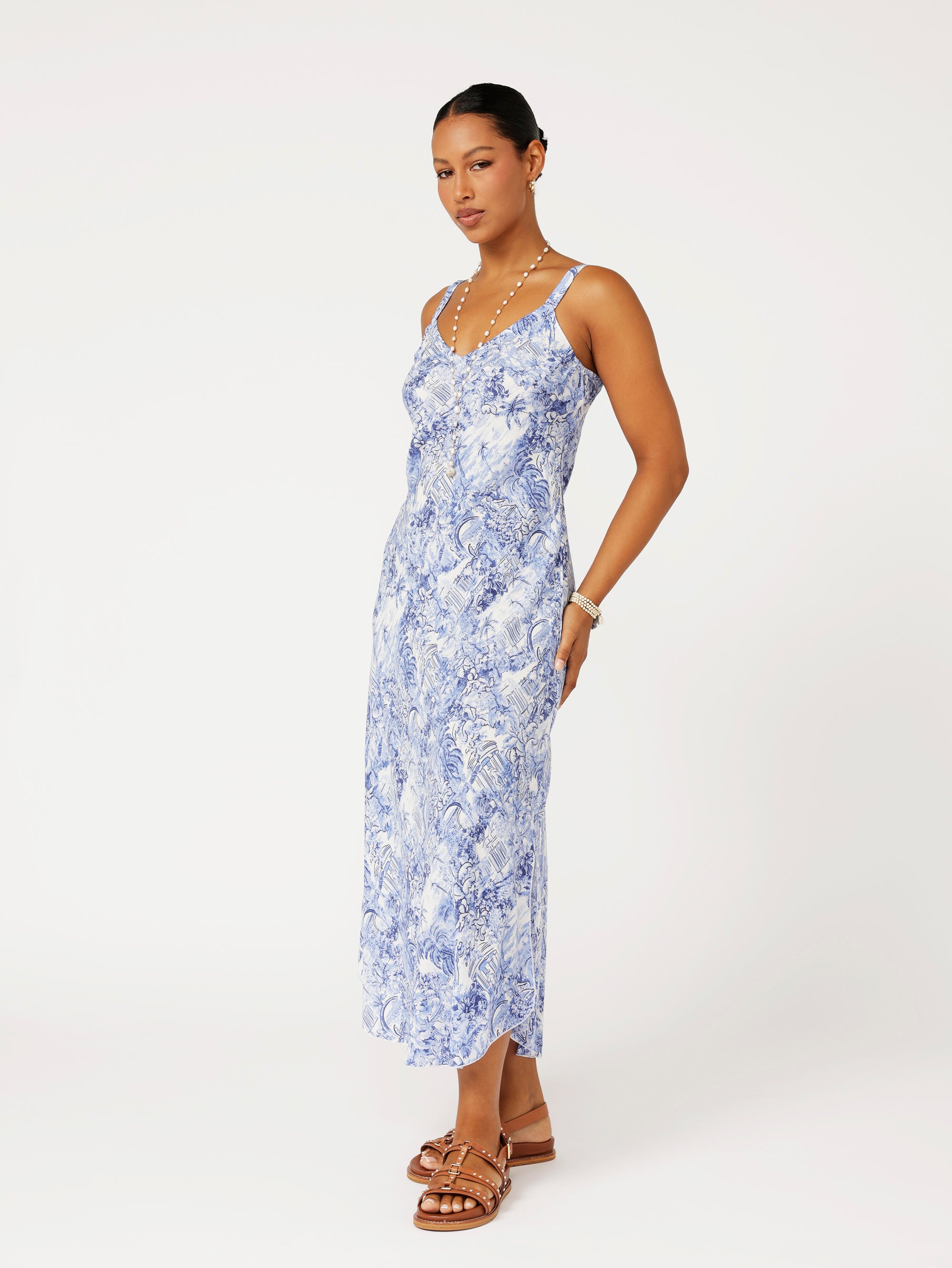 Model wearing the Lost City Slip Dress in blue Toile de Jouy rayon print.