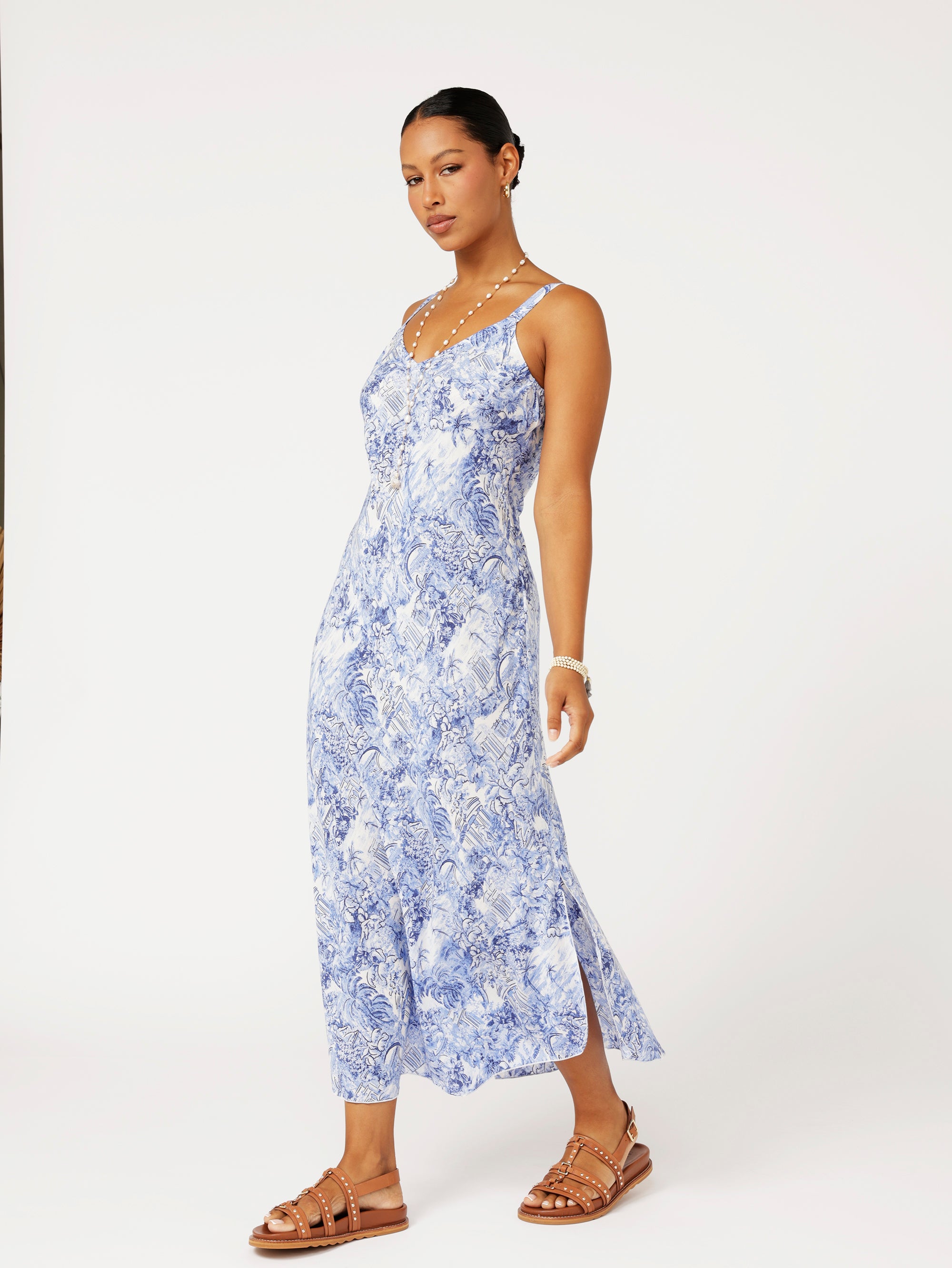Model wearing the Lost City Slip Dress in blue Toile de Jouy rayon print.
