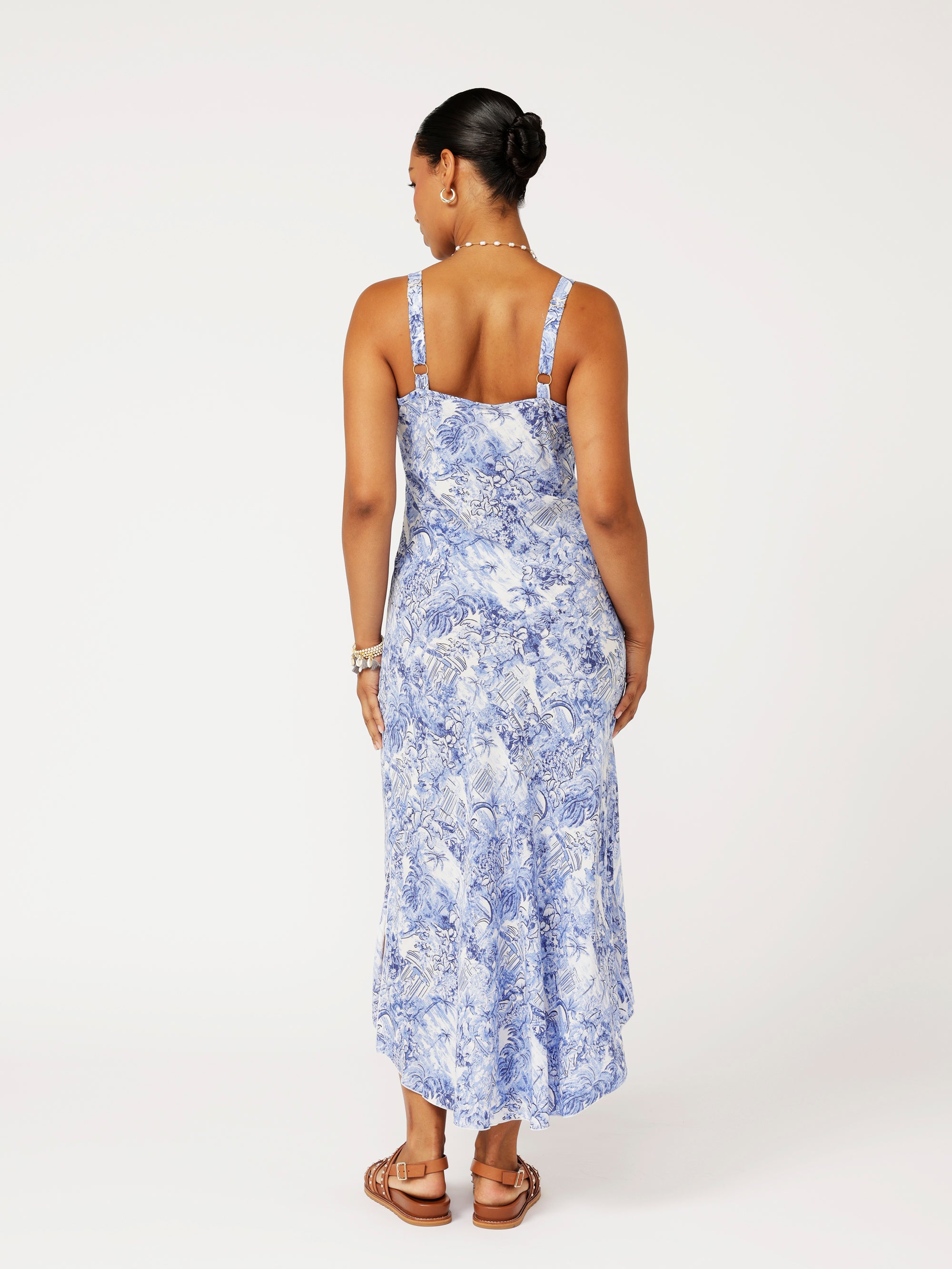 Back view of model wearing the Lost City Slip Dress in blue Toile de Jouy rayon print.