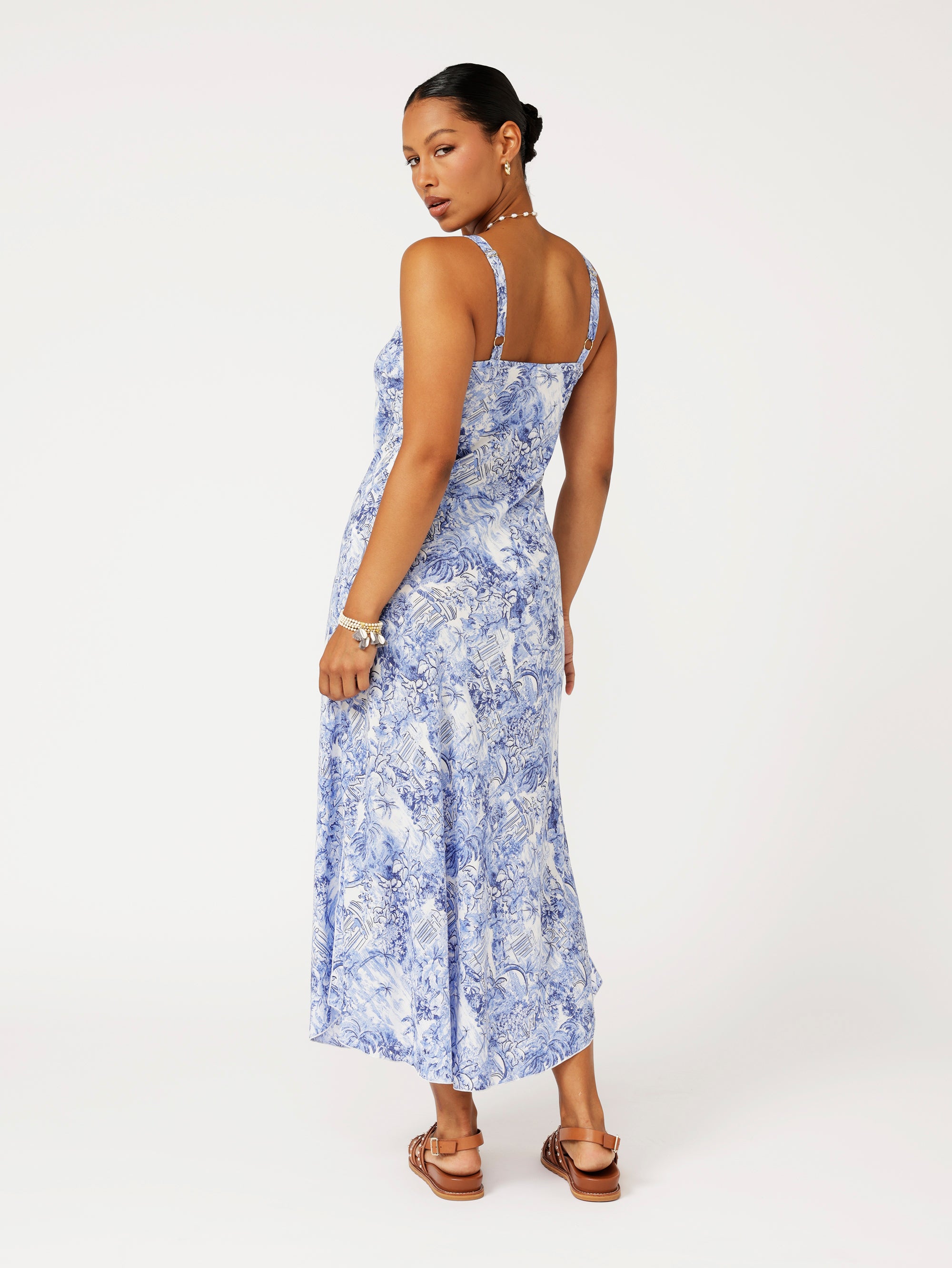 Back view of model wearing the Lost City Slip Dress in blue Toile de Jouy rayon print.