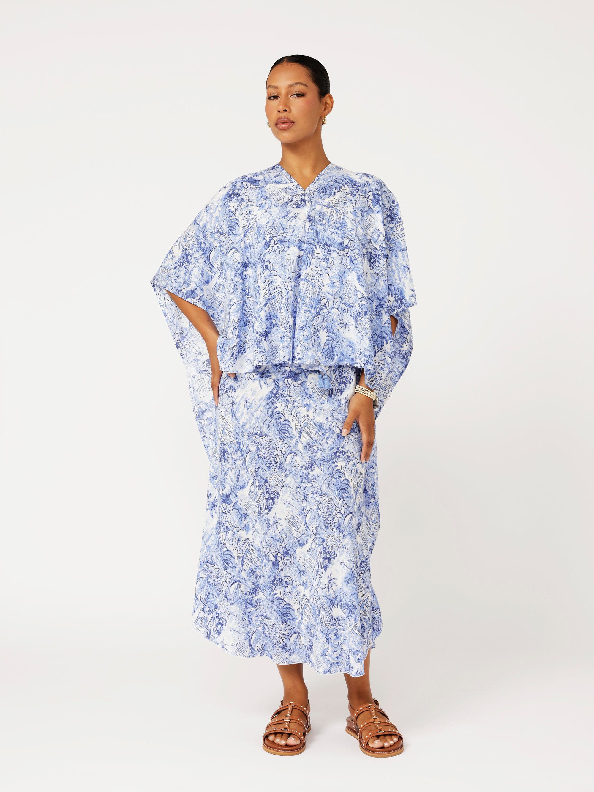 front view of model wearing blue Toile de Jouy Soiree Wrap with relaxed drape and V-back detail.