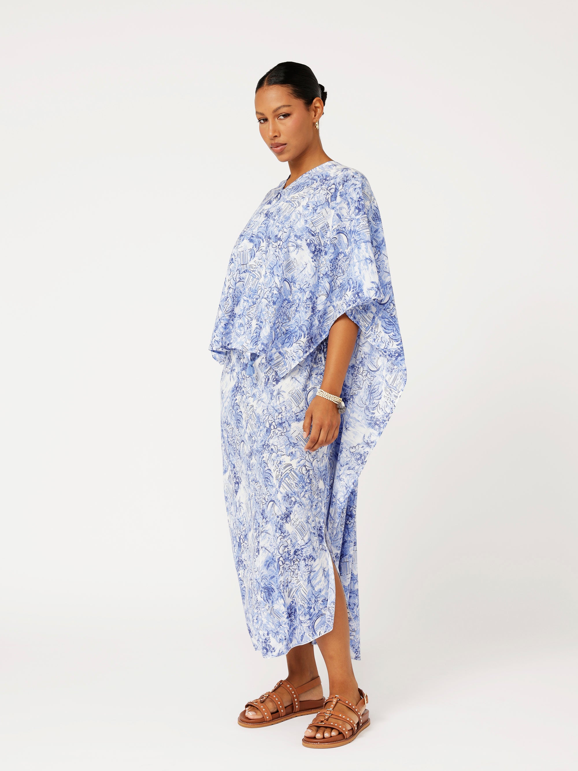 side view of model wearing blue Toile de Jouy Soiree Wrap with relaxed drape and V-back detail.
