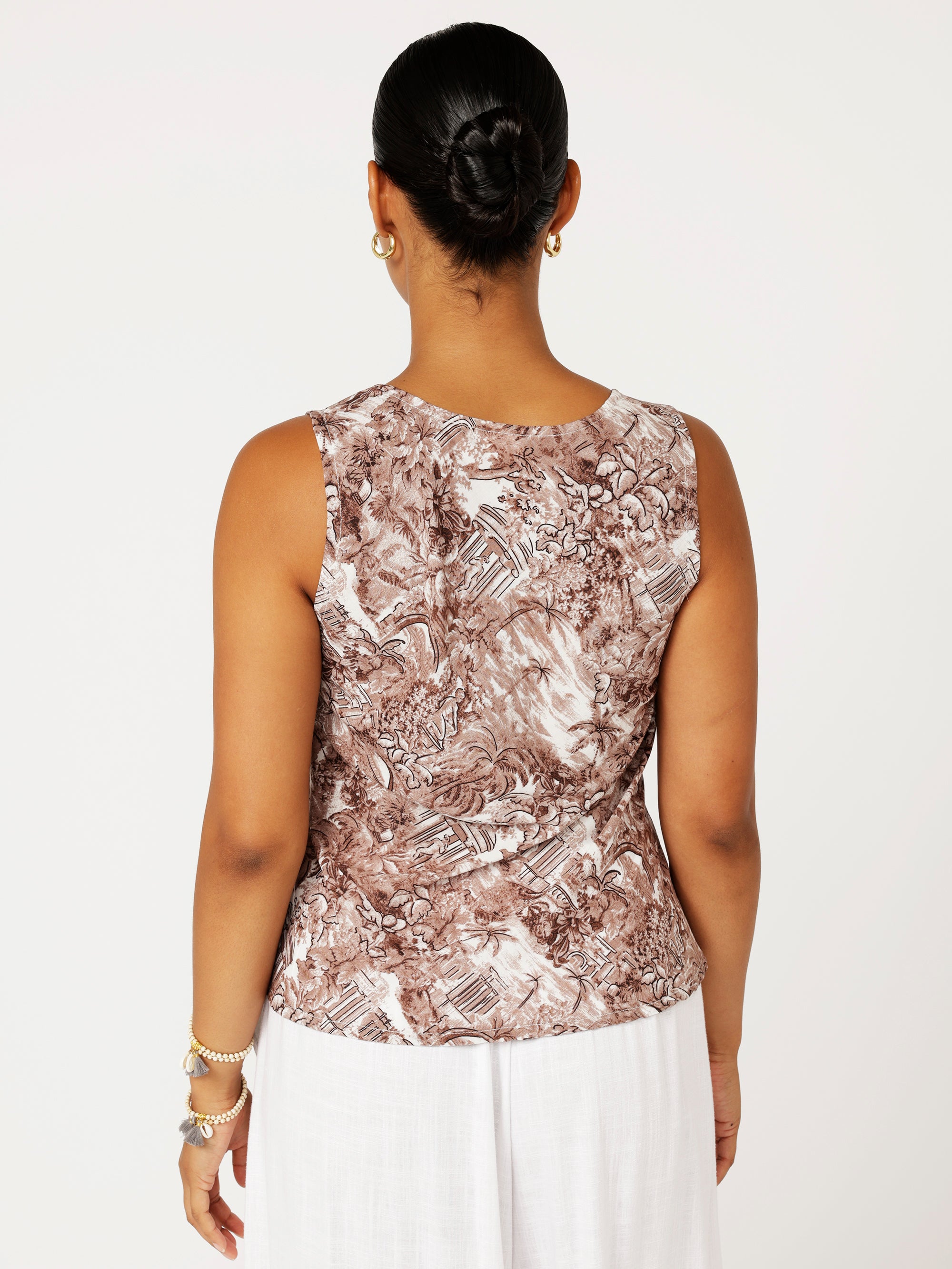 Close-up back view of Scoop Neck Top in brown Toile de Jouy rayon print with white pants, showcasing scoop neckline and soft drape