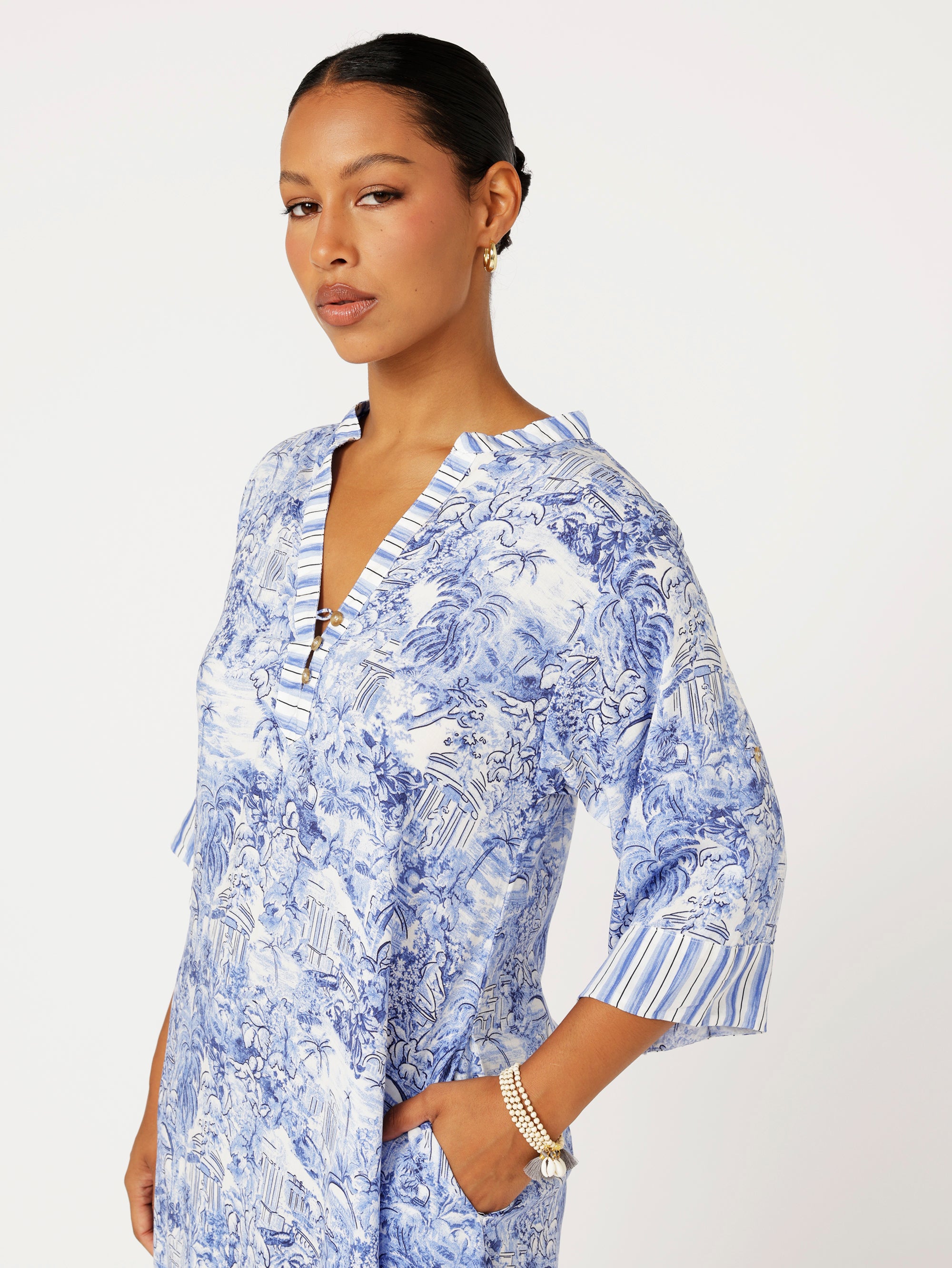 close up view of model wearing the Jet Set Gypsy Dress in blue Toile de Jouy rayon print