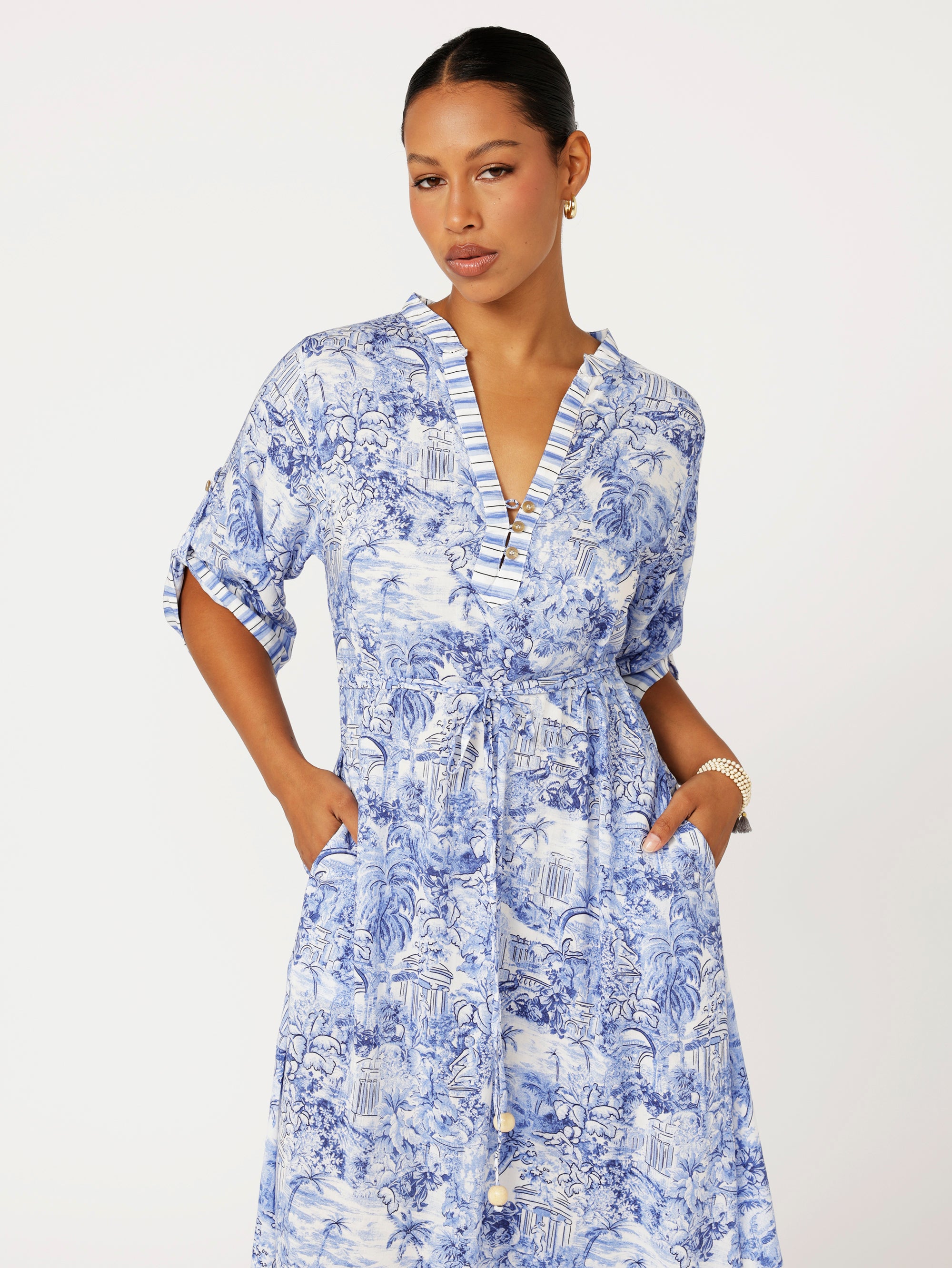 close up view of model wearing the Jet Set Gypsy Dress in blue Toile de Jouy rayon print