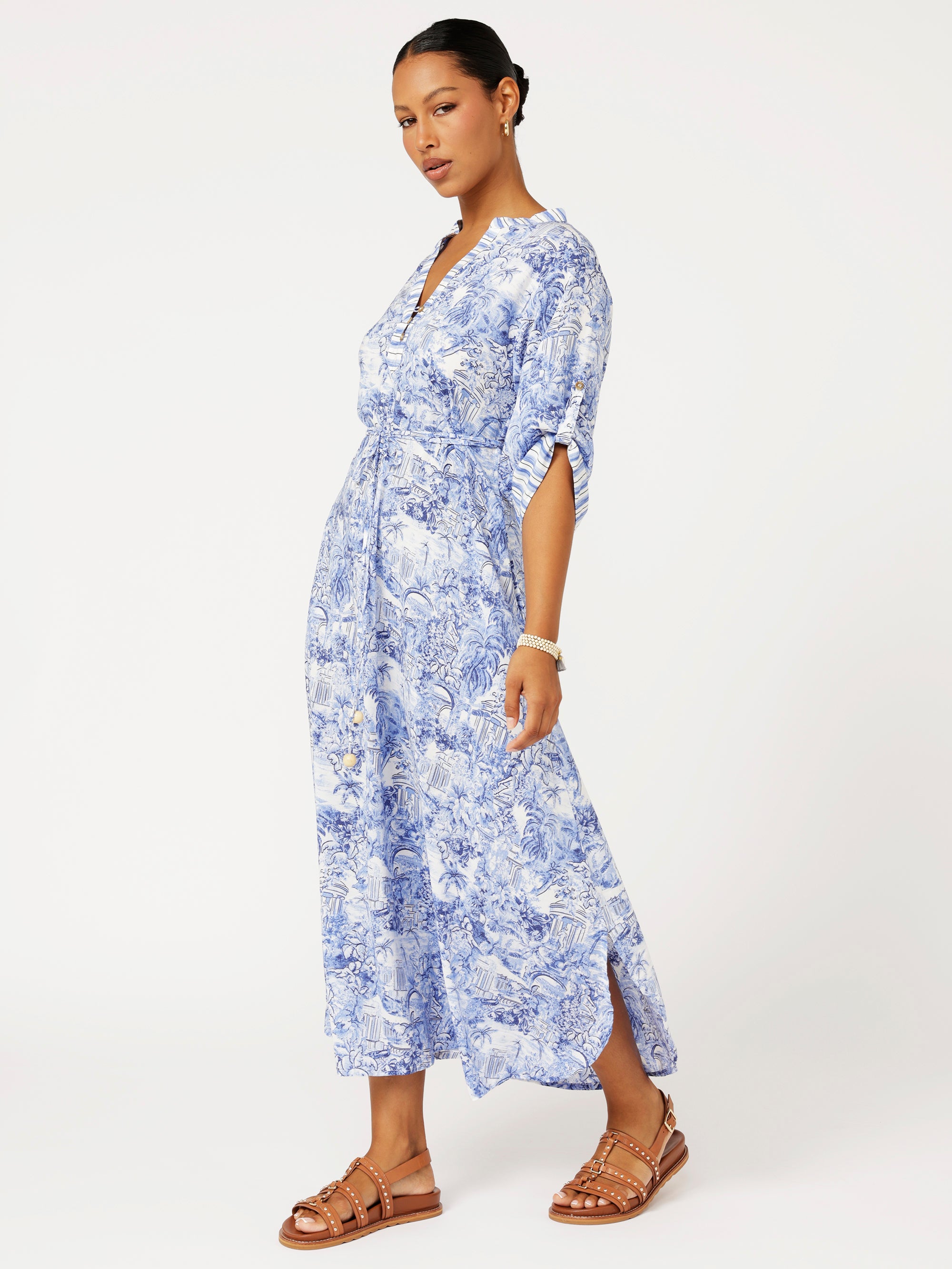 Side view of model wearing the Jet Set Gypsy Dress in blue Toile de Jouy rayon print