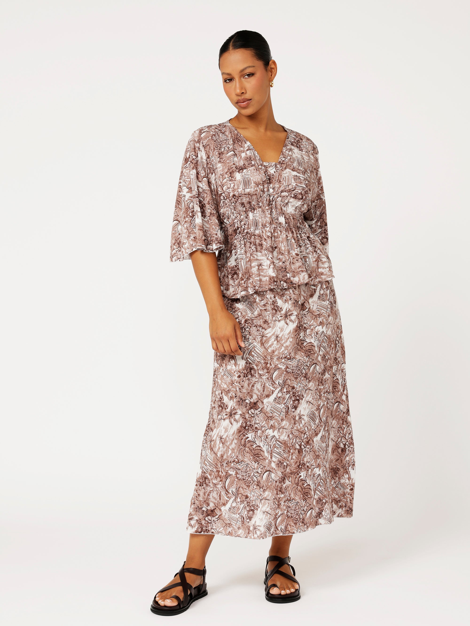 Front view of model wearing the Violet Skirt in chocolate Toile de Jouy rayon print, styled with matching Thalia Top for a coordinated resort look