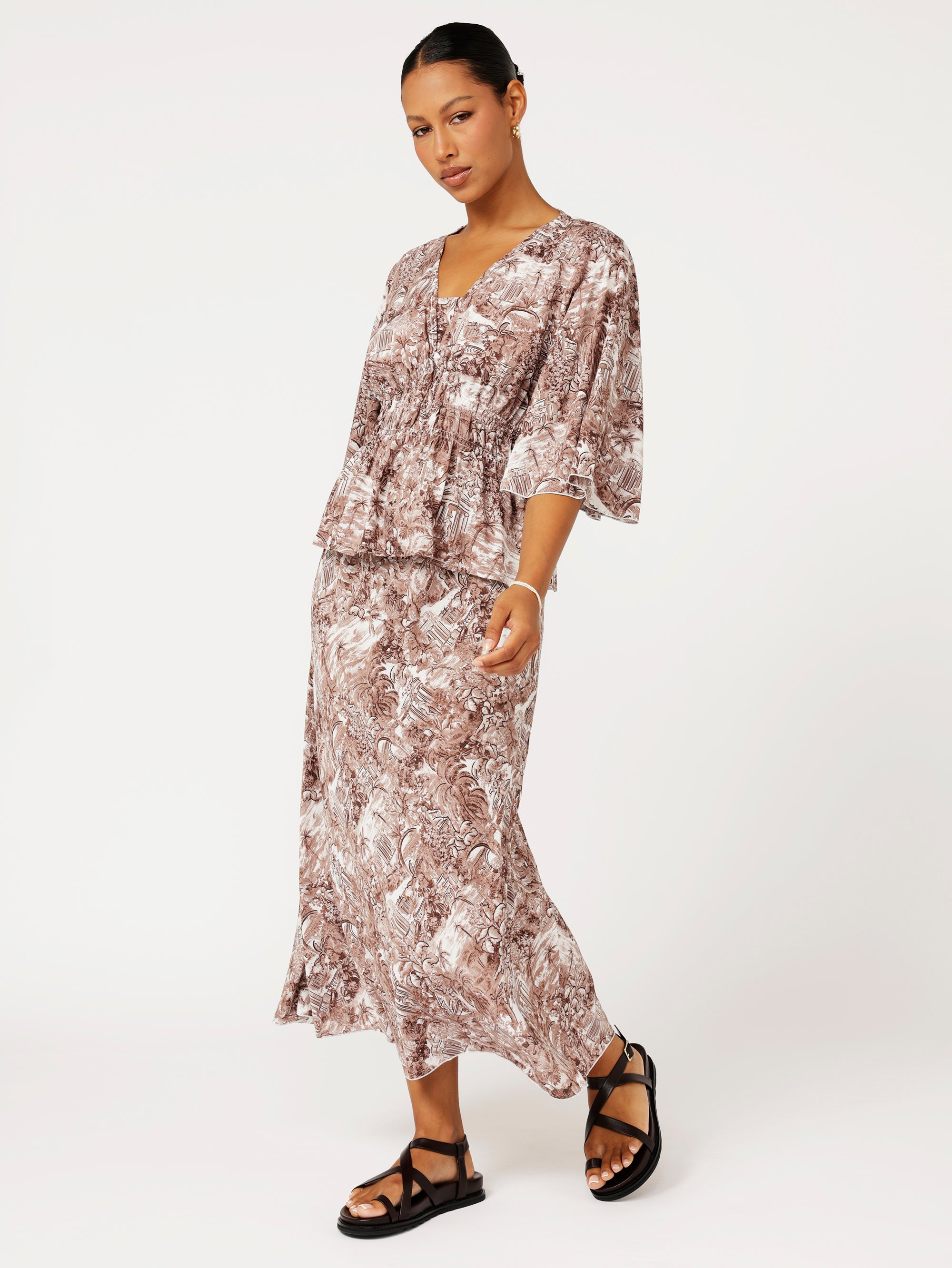 Front view of model wearing the Violet Skirt in chocolate Toile de Jouy rayon print, styled with matching Thalia Top for a coordinated resort look