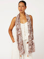 Front view of brown Toile de Jouy rayon scarf draped loosely over shoulders for relaxed resort look