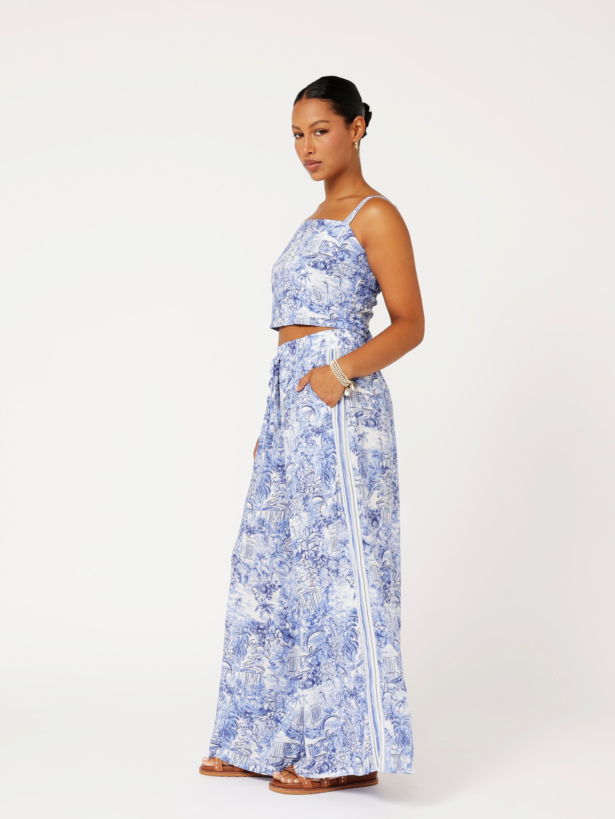 Side view of model wearing the Lost City Bralette in blue Toile de Jouy rayon print