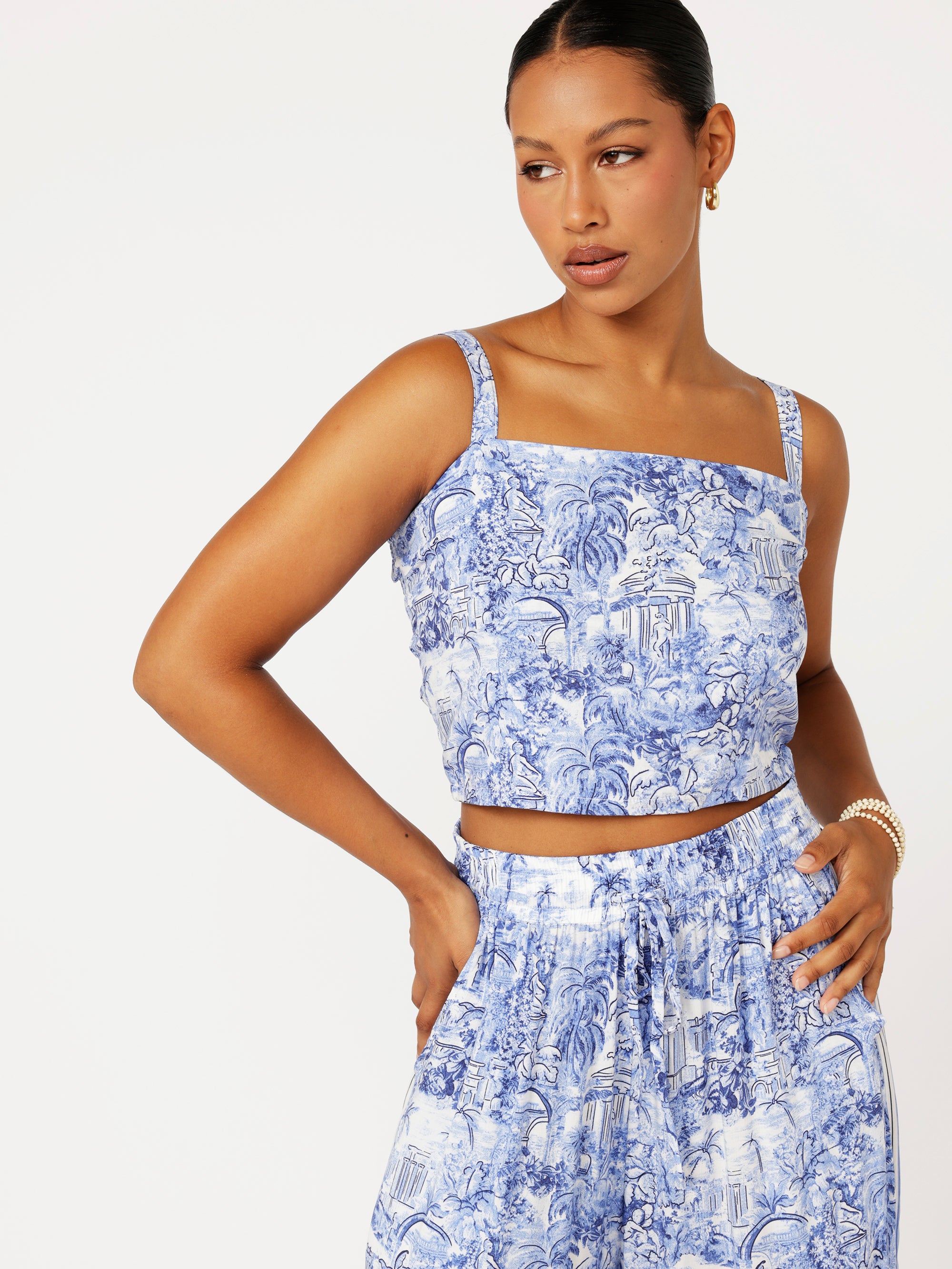 close up  view of model wearing the Lost City Bralette in blue Toile de Jouy rayon print