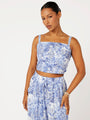 Front view of model wearing the Lost City Bralette in blue Toile de Jouy rayon print