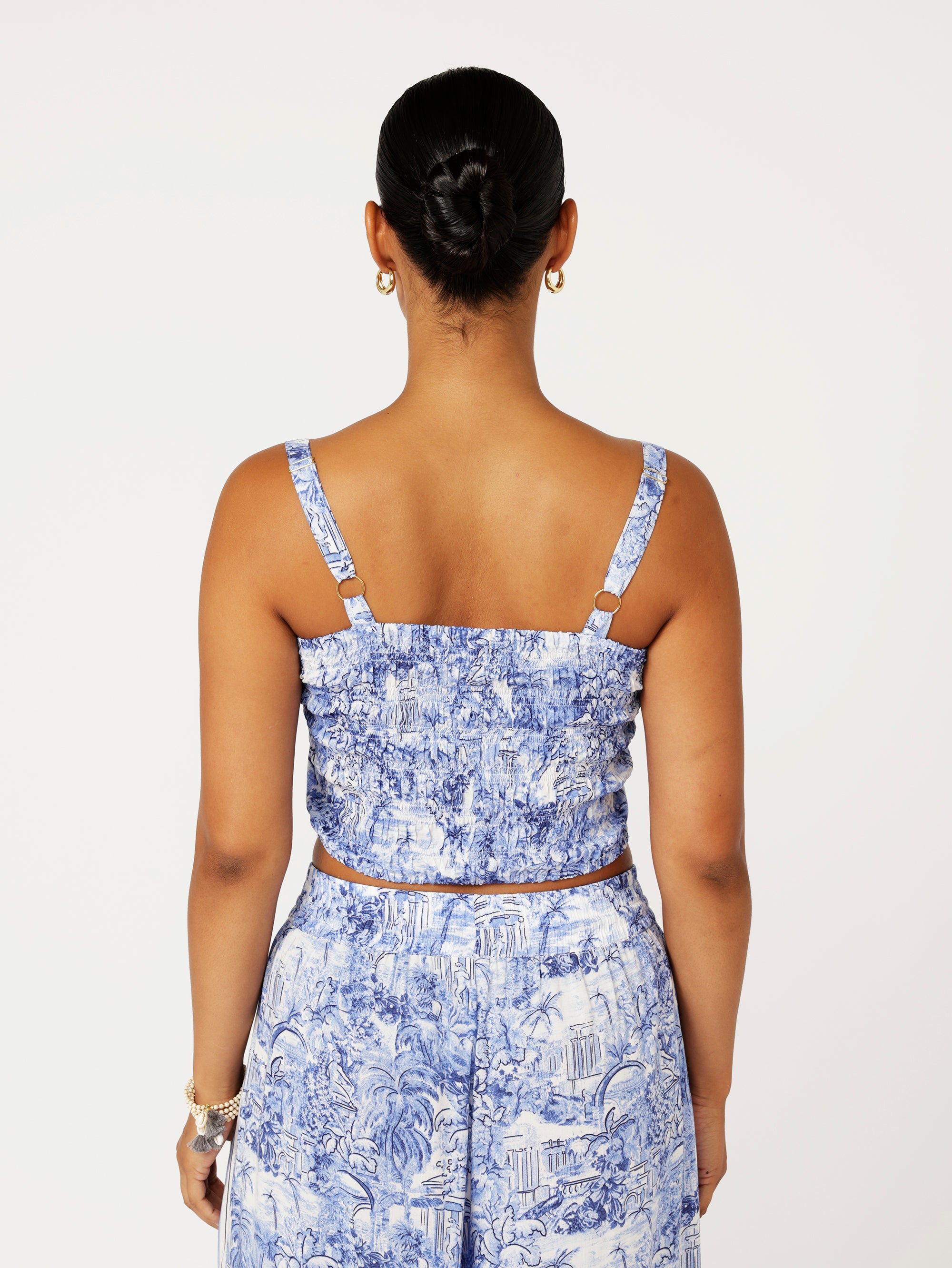 back view of model wearing the Lost City Bralette in blue Toile de Jouy rayon print