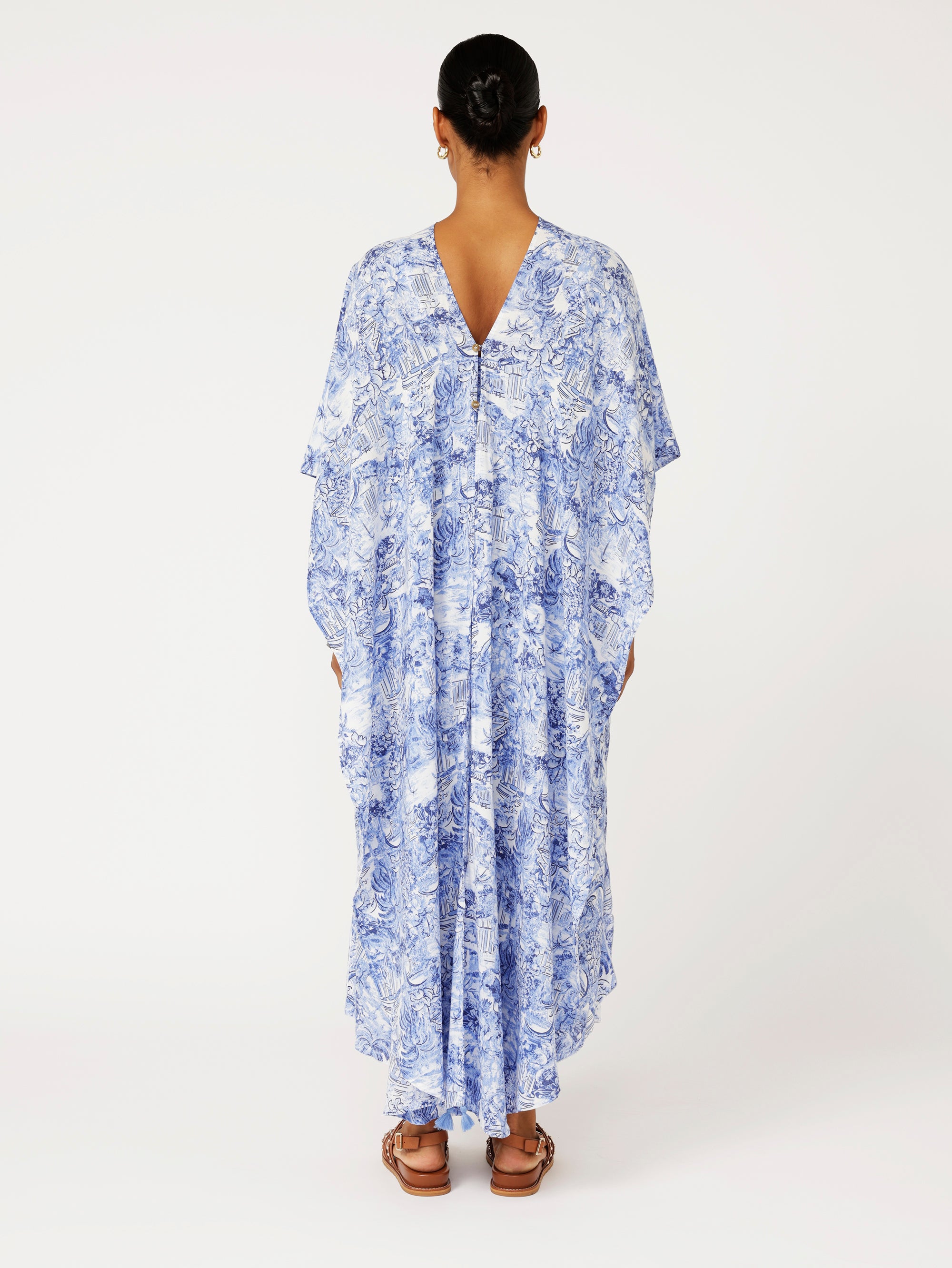 Back view of model wearing blue Toile de Jouy Soiree Wrap with relaxed drape and V-back detail.
