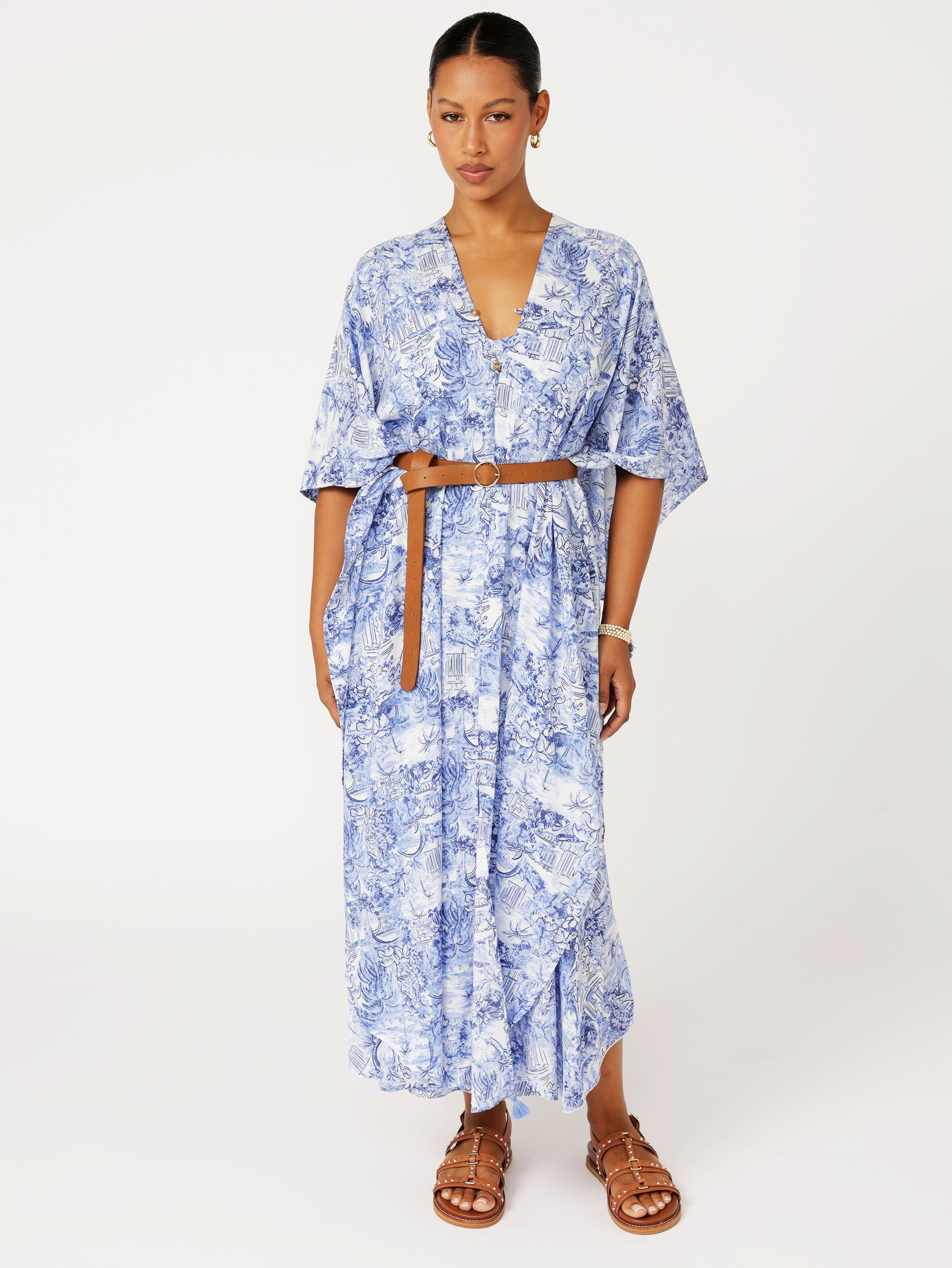 Soiree Wrap in blue Toile de Jouy print styled with belt for chic resort wear and summer event look