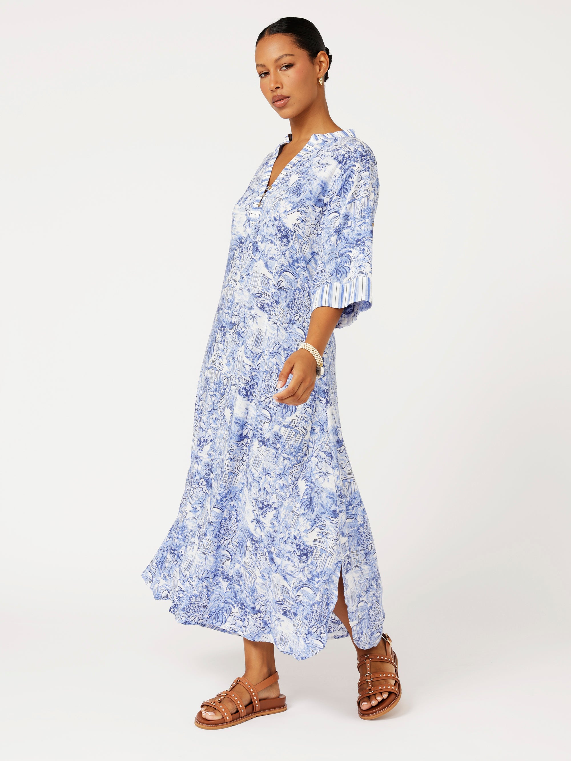 Side view of model wearing the Jet Set Gypsy Dress in blue Toile de Jouy rayon print